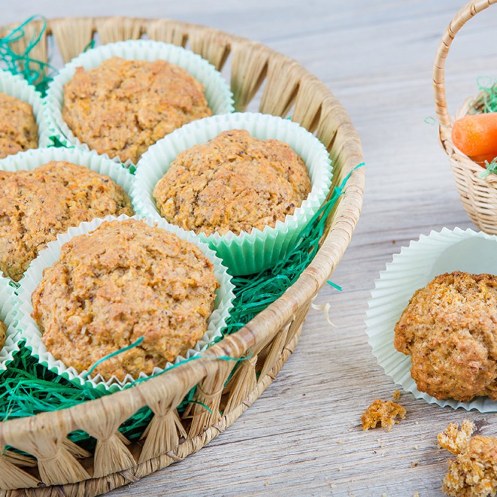 16754198 - homemade fresh baked carrot muffins with hazelnut and cinnamon on wooden background